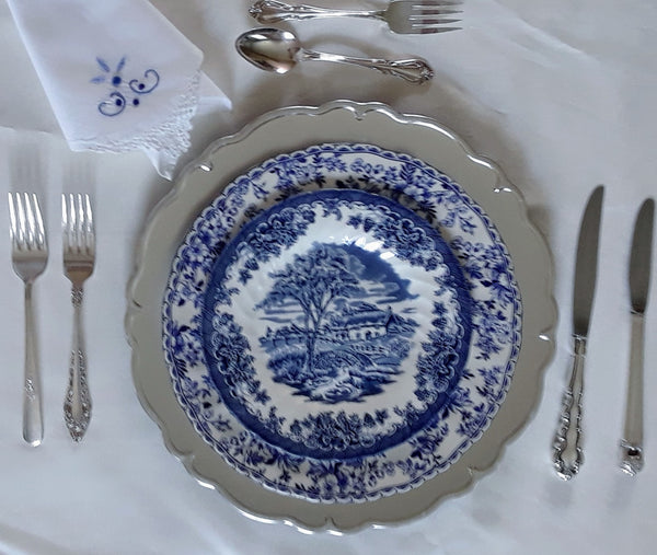 Silver Scroll Charger Plates with blue & white plates for rent by Royal Table Settings