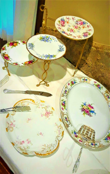Medium Size 3-Tier Gold Stack Serving Tray with Vintage Plates next to Large Serving Platter and Cake Plate buffetor sweets table. Party Rentals. Royal Table Settings.