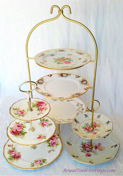 2 and 3-Tier Porcelain Cake Stand next to High Tea Tier Stand for your Tea Party, Fundraiser ideas and more. Vintage Party Rentals. Royal Table Settings.