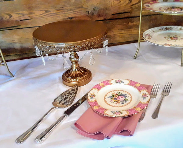 Cake Knife Server Set with Vintage Floral Plate and Round Gold Chandler Cake Stand by Royal Table Settings Party Rentals. 