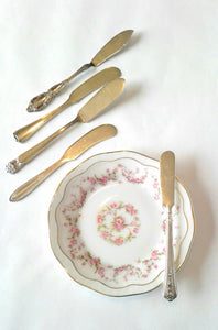 Silver-Plated Butter Knives with Vintage Mismatched China