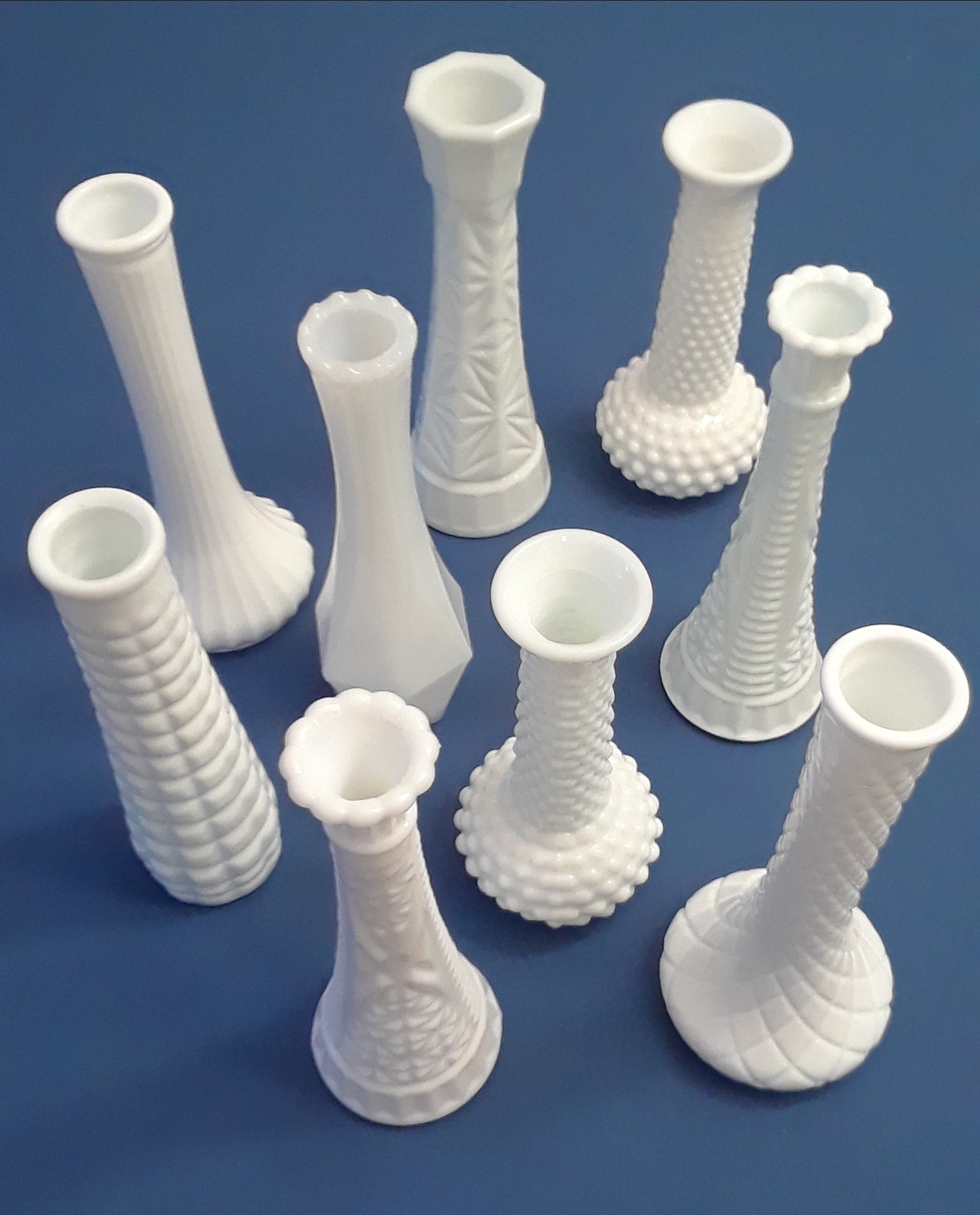 Milk Glass Bud Vases. Party Rentals. Royal Table Settings.