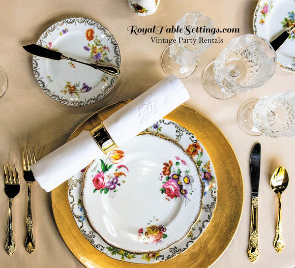 Gold Flatware Vintage Plates Crystal Glasses and Gold Charger and Napkin Rings. Party Rentals by Royal Table Settings.