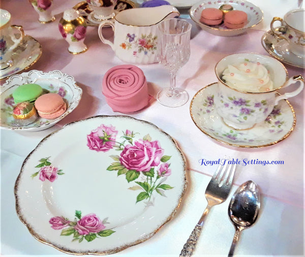 Rose Napkin Fold next to Tea Cup and Salad Plate. Vintage Party Rentals by Royal Table Settings. Napkin Rentals. 