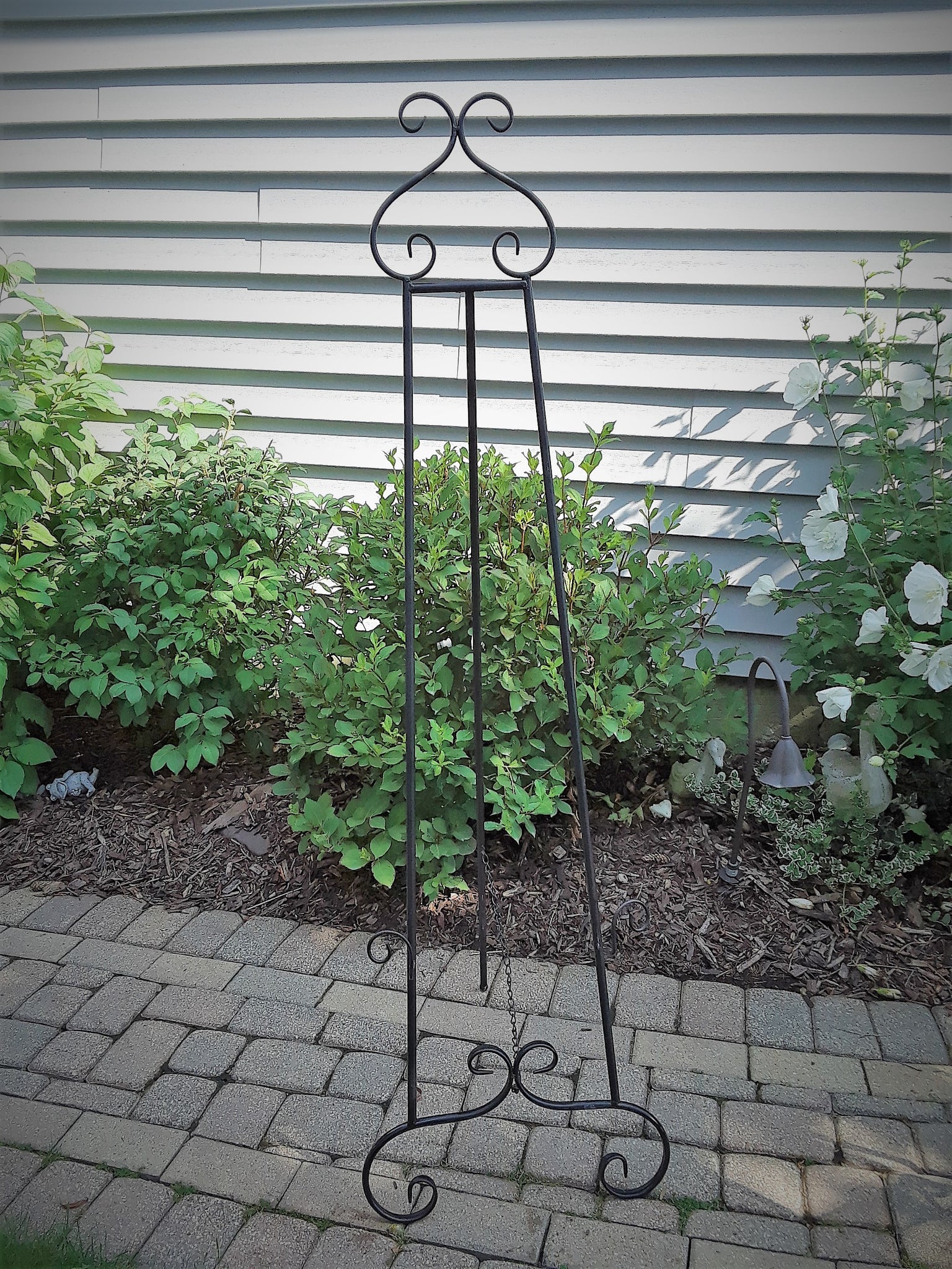 Large Black Scroll Floor Easel.Display your Art, Pictures or Corporate Signage. Choose from 6 different Easel Styles to rent. Royal Table Settings Vintage Party Rentals