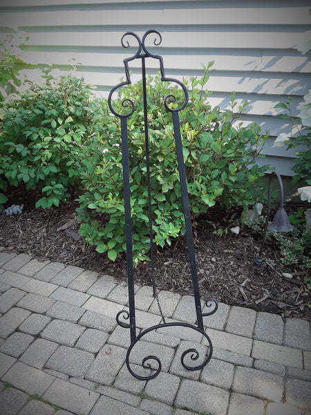Short Black Scroll Floor Easel. Display your Art, Pictures or Corporate Signage. Choose from 6 different Easel Styles to rent. Royal Table Settings Vintage Party Rentals