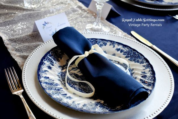 Blue and White Vintage Plates on Silver Charger for Rent. Vintage Party Rentals by Royal Table Settings.