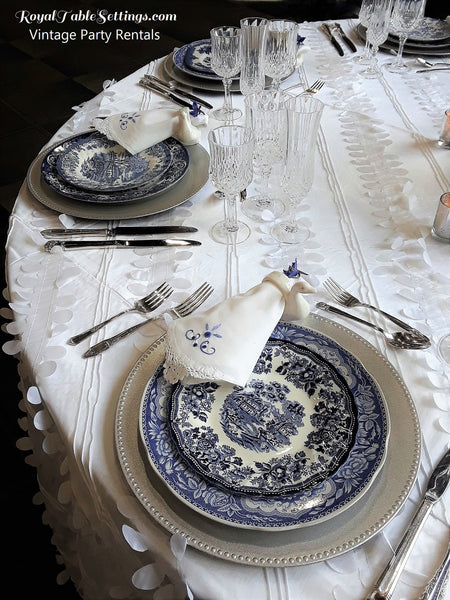 Blue and White Vintage Plates, crystal water glasses and silverware for Rent. Vintage Party Rentals by Royal Table Settings.