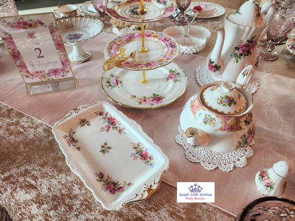 Tea Party with teapots, tea cups, sandwich tray, salad plate and more. Vintage Party Rentals. Tea Party. Royal Table Settings.